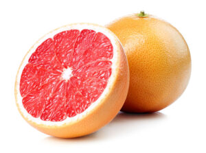 Whole And Half Of Grapefruit